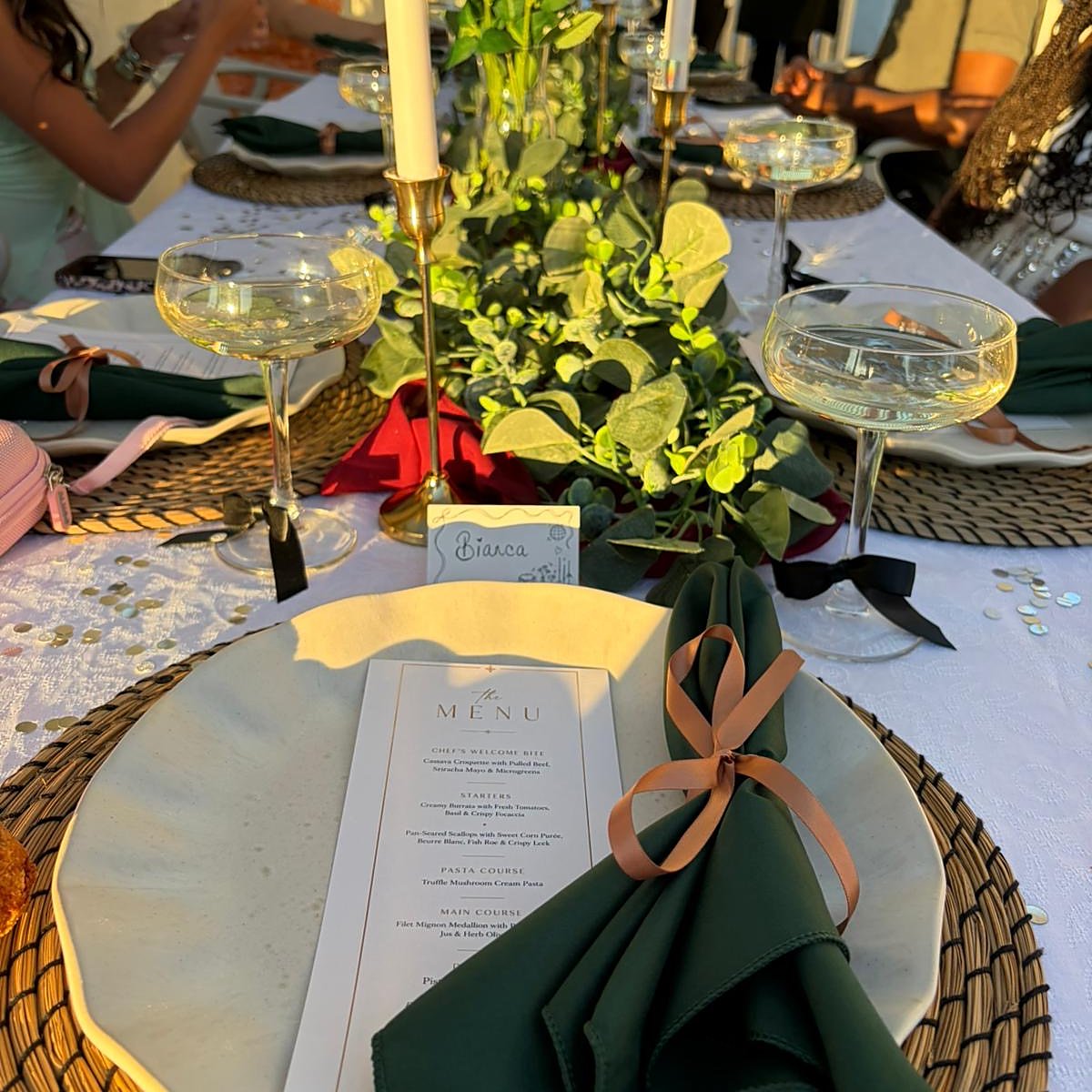 A place setting at golden hour with a printed menu
