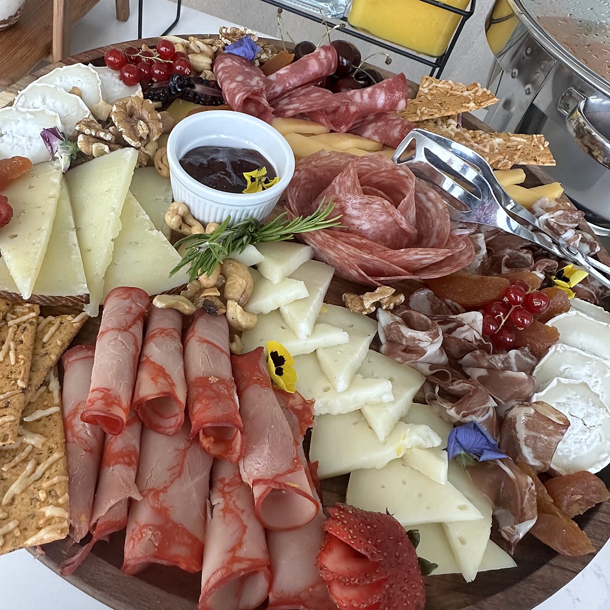 A board of cured meats and cheeses