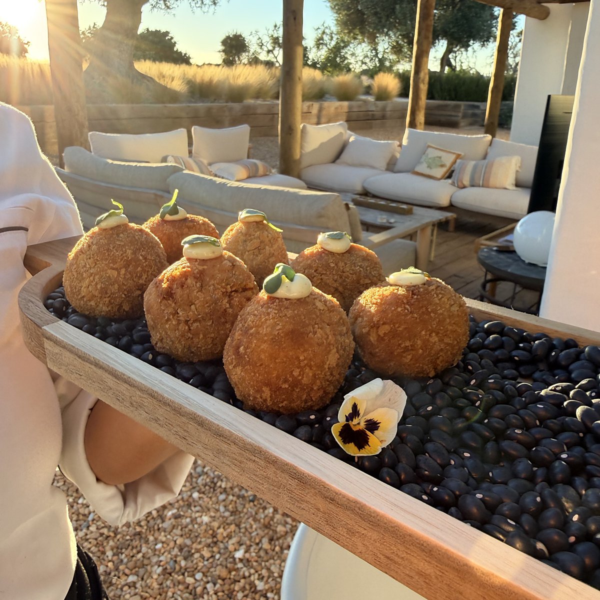 Croquettes on a wooden board on a terrace