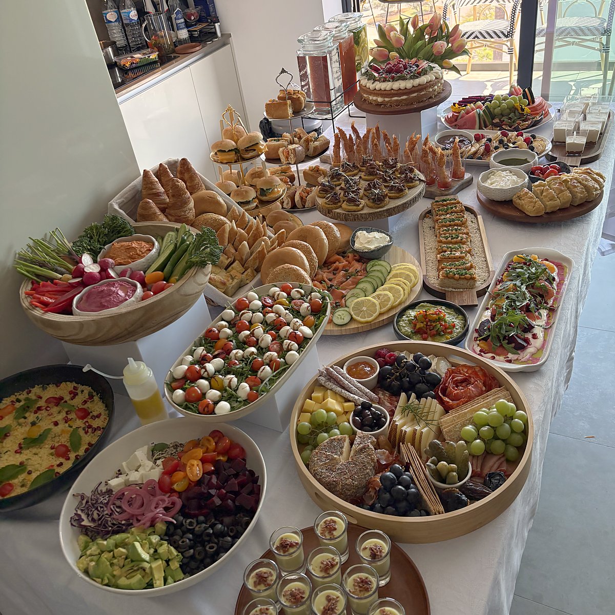A long buffet table with many small dishes